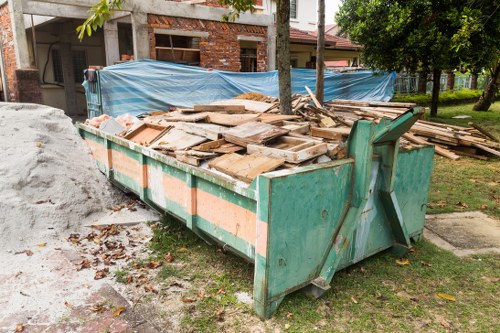 Homeowner enjoying a tidy garden after clearance